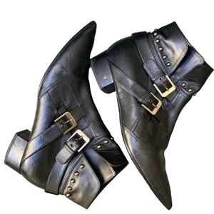 Pointy toed, ankle boots. Silver buckles . Very classy.